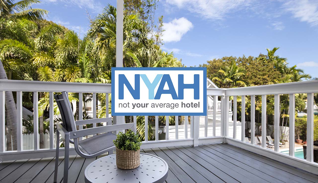 NYAH room balcony with logo over image.