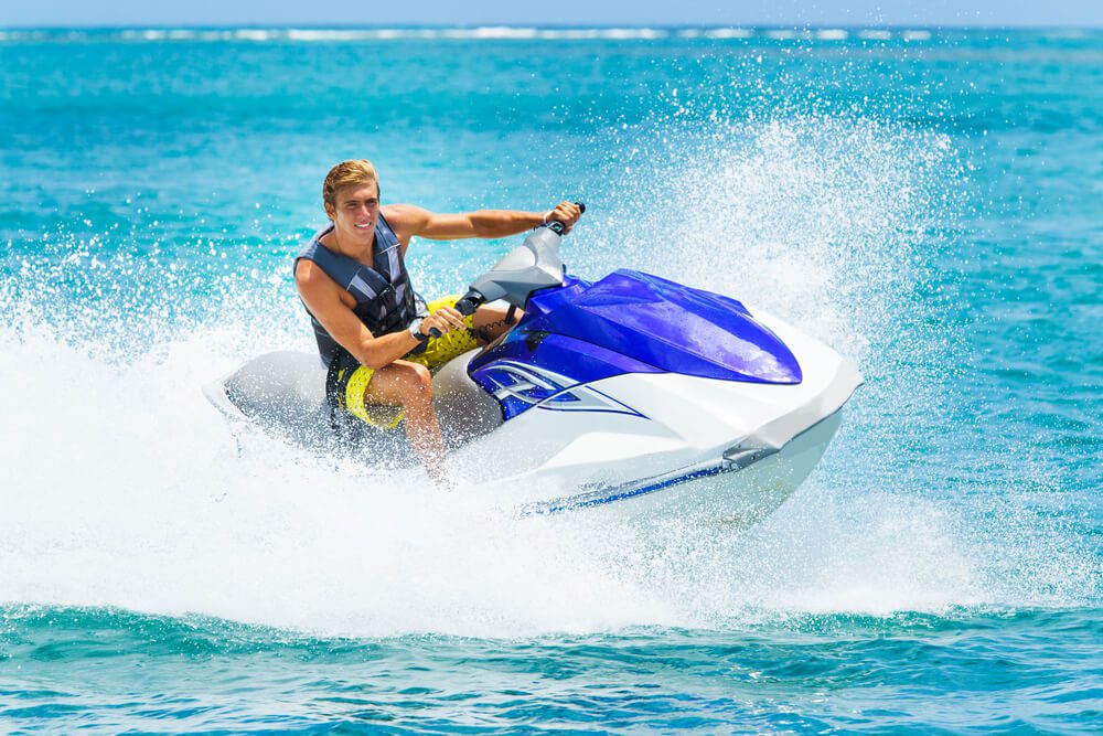 A man riding Key West waters on a jet ski.
