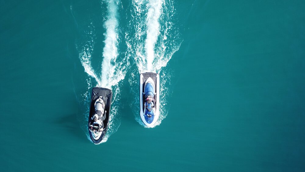 People riding on jet skis during their Florida summer vacation to Key West.